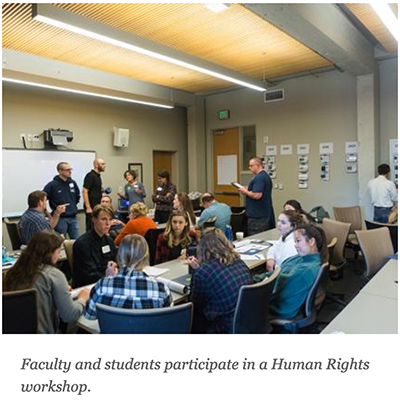 Faculty and students participate in a Human Rights workshop.